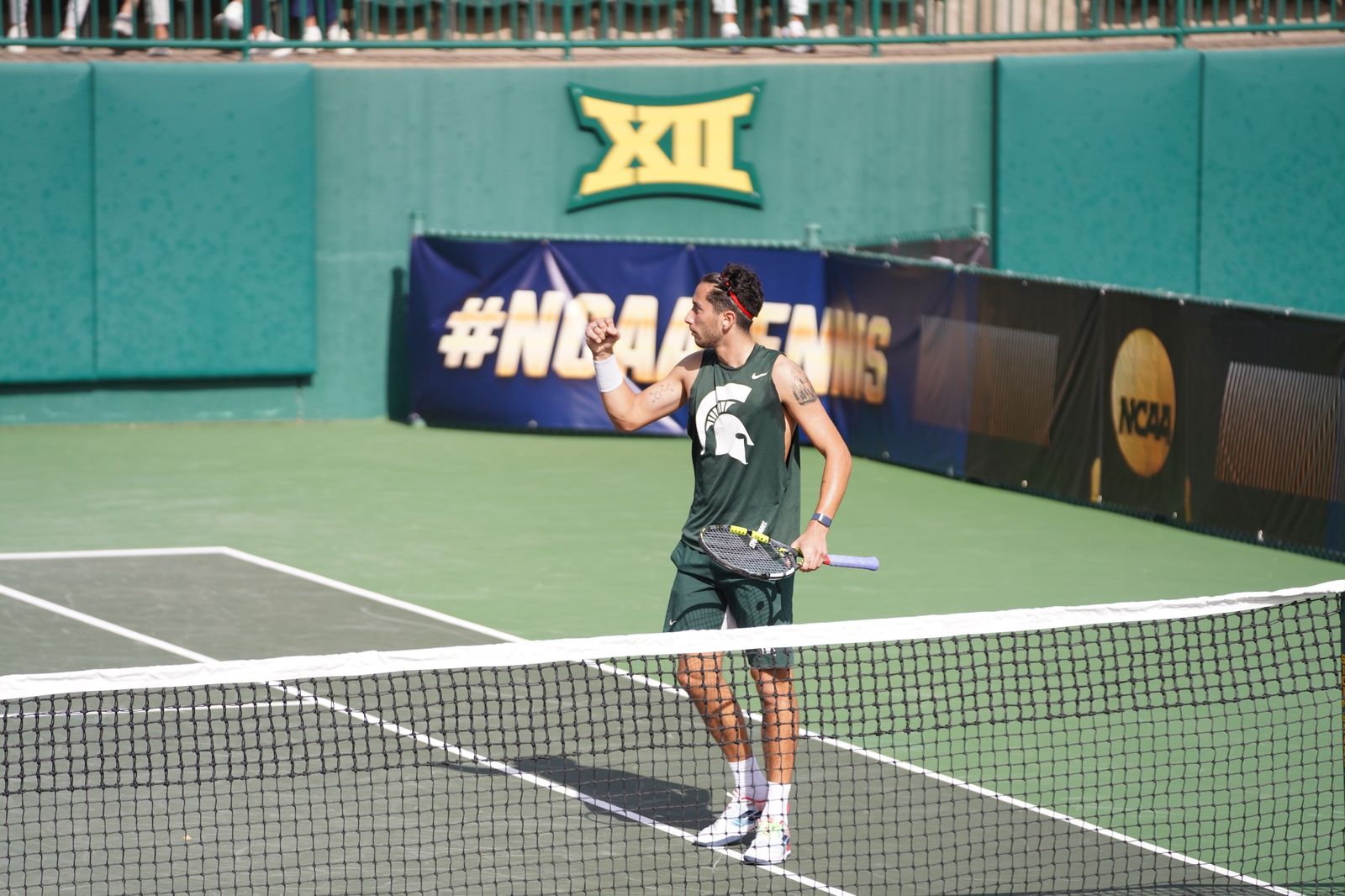 Ozan Baris pumping his fist at the NCAA Championships